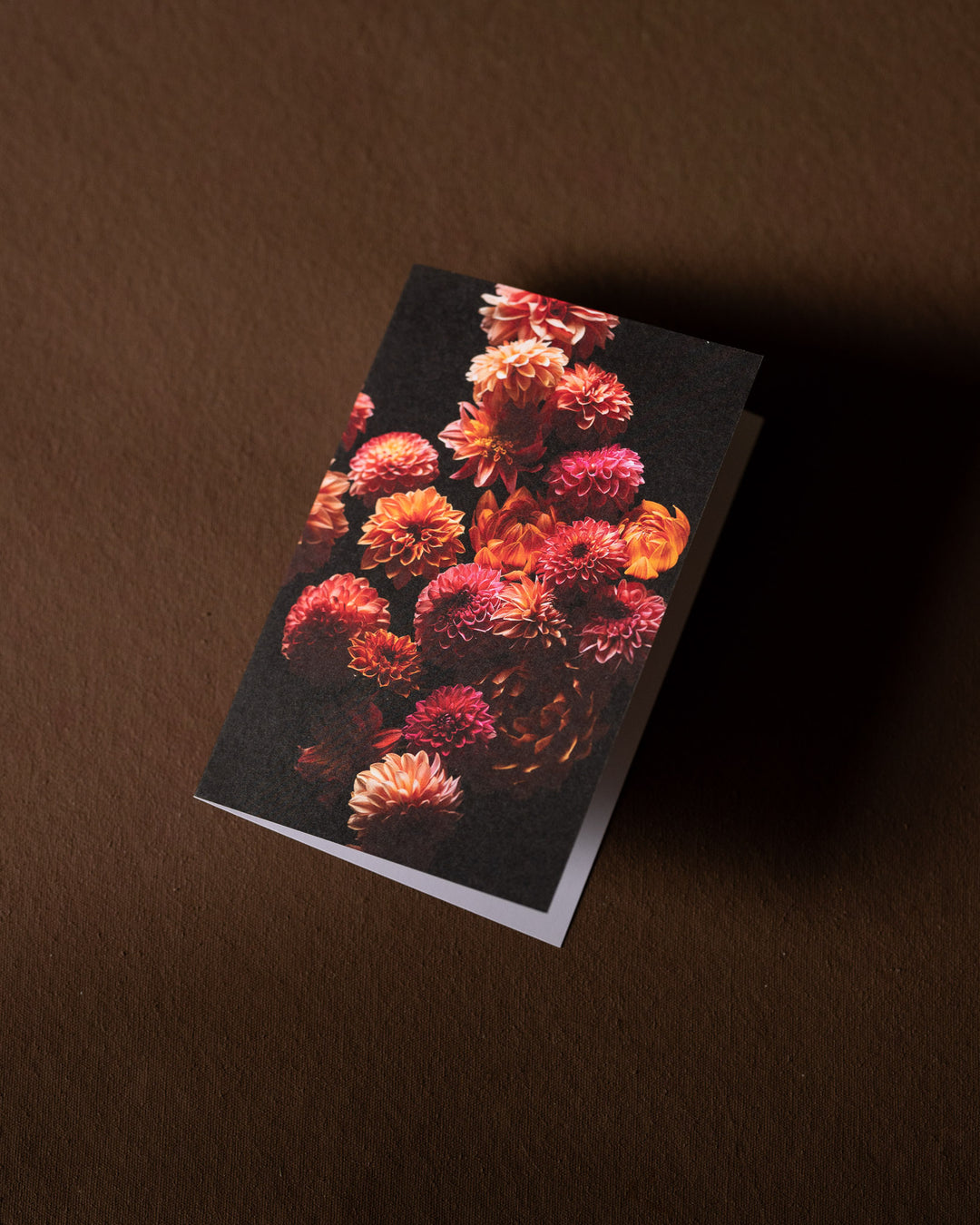 blank greeting card with pink and orange dahlia flowers