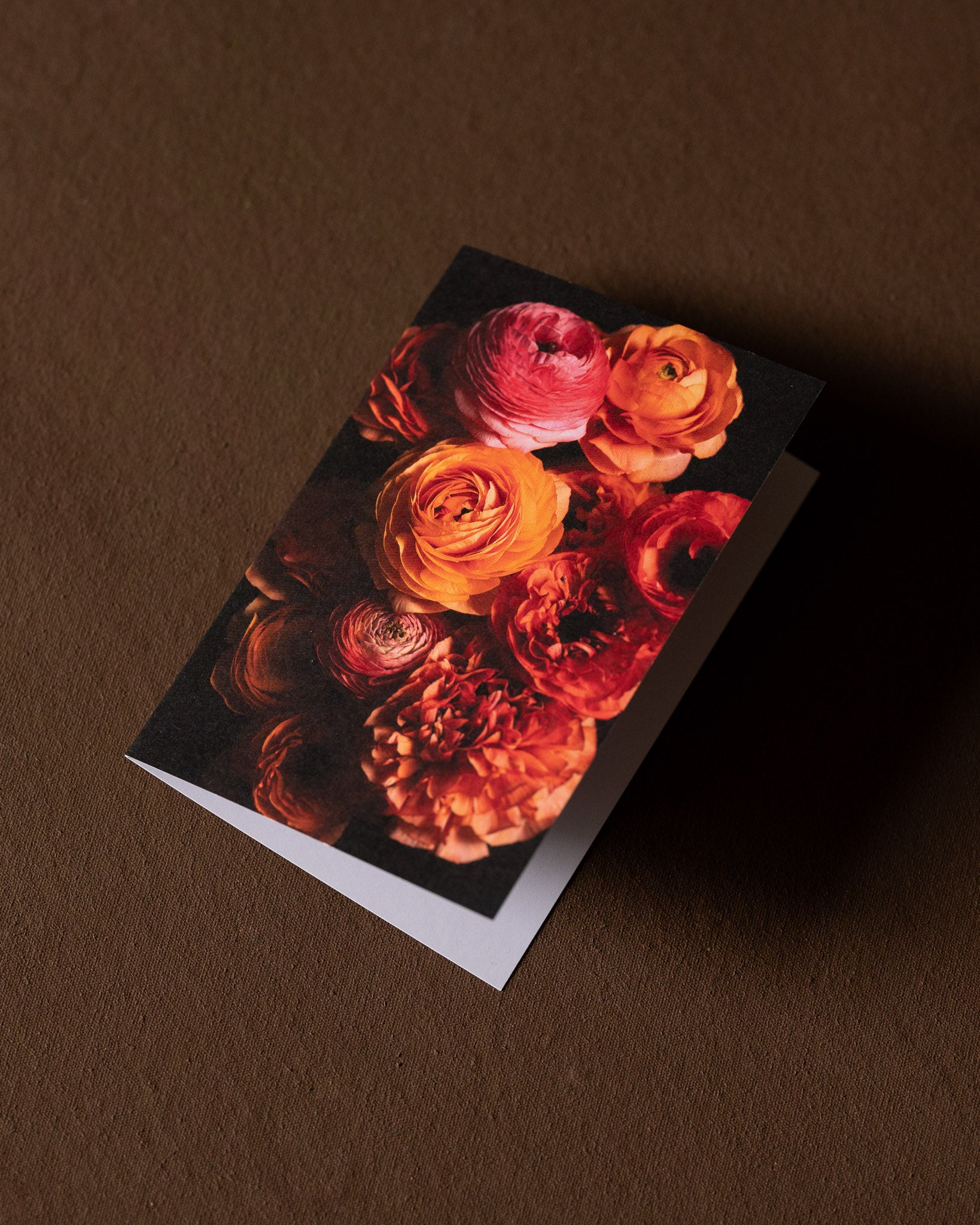 greeting card with Ranunculus Arrangement in pinks and oranges